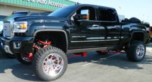 Black pickup truck with suspension lifts