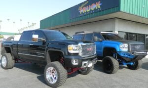 Blue and black pickup trucks