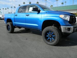 Blue pickup truck with matching blue wheels